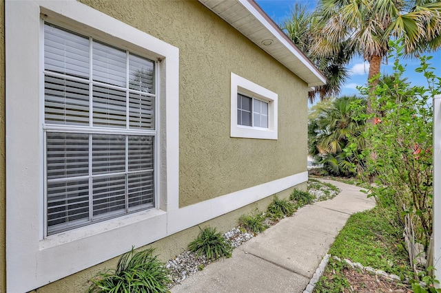 view of property exterior with stucco siding