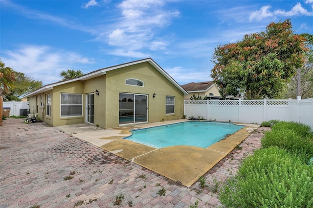 view of pool featuring a fenced backyard, a fenced in pool, and a patio