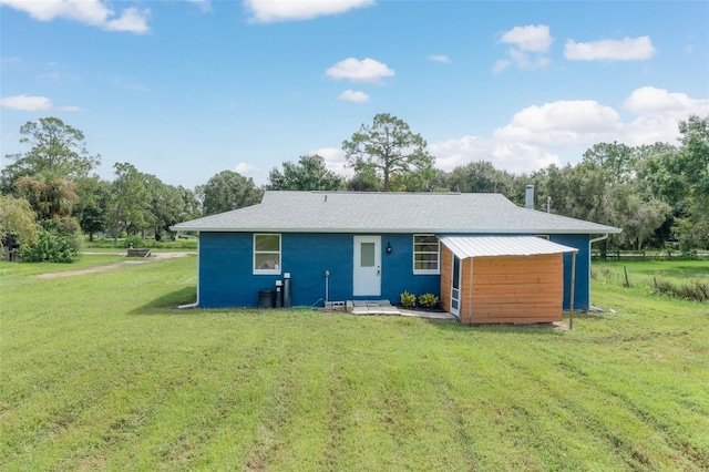 back of house with a yard