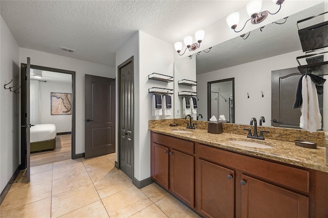 full bath with double vanity, visible vents, a sink, and tile patterned floors