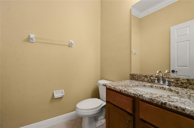 bathroom featuring tile patterned flooring, crown molding, baseboards, toilet, and vanity