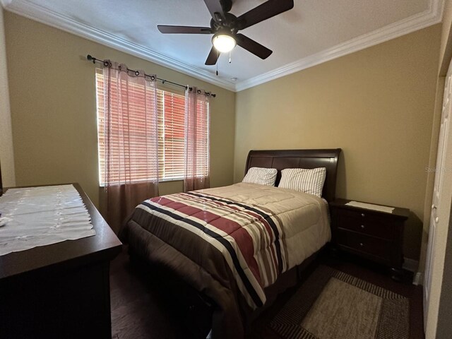 bedroom featuring ceiling fan and ornamental molding