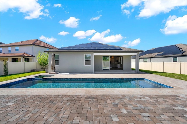 view of pool with an in ground hot tub, a patio area, a fenced in pool, and a fenced backyard