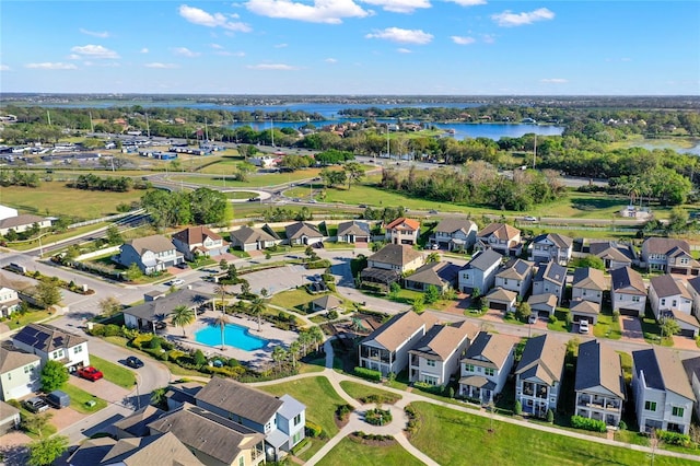 birds eye view of property featuring a residential view and a water view