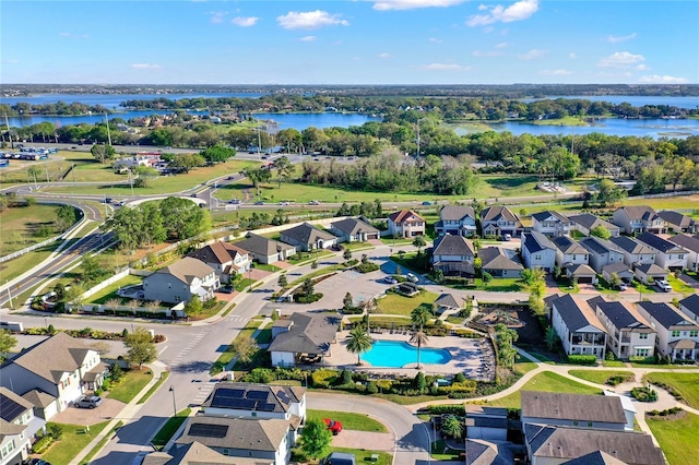 drone / aerial view with a residential view and a water view