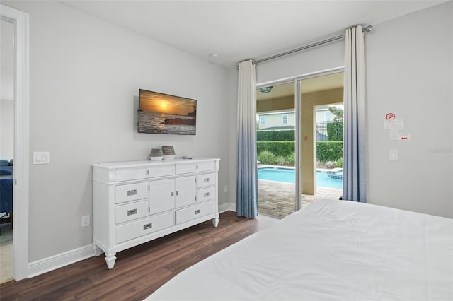 bedroom featuring access to outside, dark wood finished floors, and baseboards