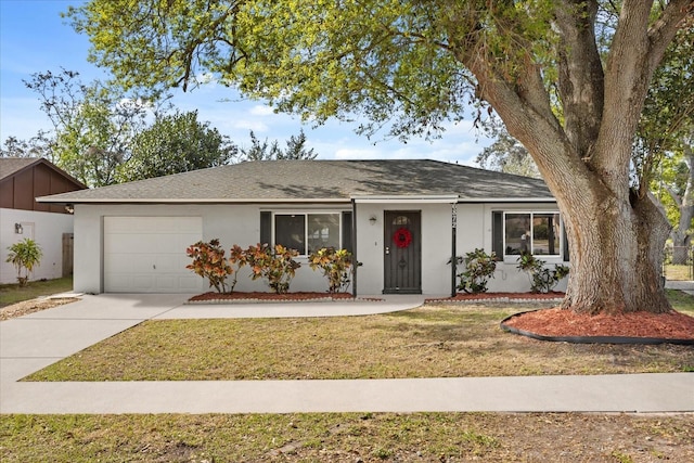 ranch-style home with stucco siding, a front lawn, concrete driveway, and an attached garage