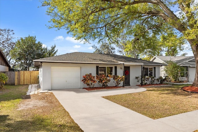 ranch-style home featuring stucco siding, driveway, fence, an attached garage, and a shingled roof