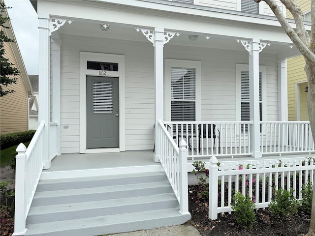 entrance to property featuring a porch