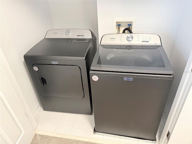 laundry room with laundry area and separate washer and dryer