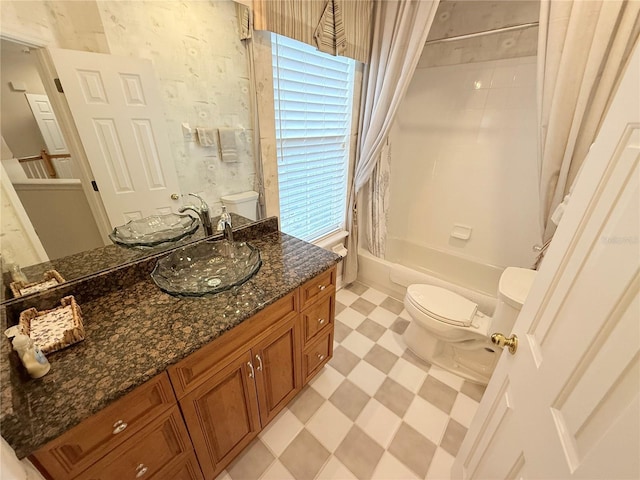 full bathroom featuring tile patterned floors, vanity, toilet, and shower / tub combo