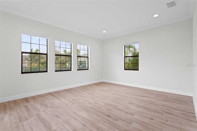 spare room featuring baseboards, recessed lighting, visible vents, and light wood-style floors