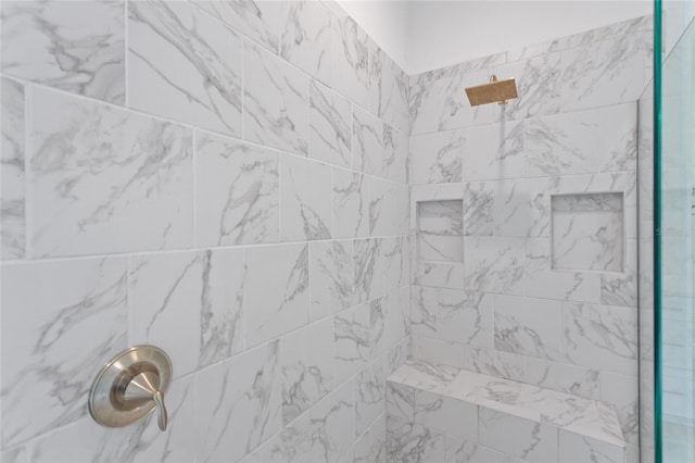 room details featuring a tile shower