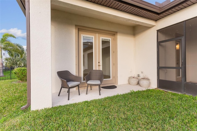 exterior space with a patio, fence, a lawn, and stucco siding