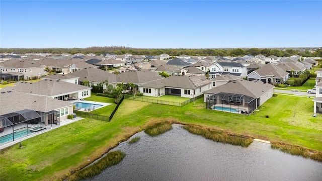 bird's eye view with a water view and a residential view