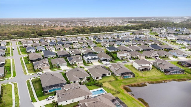 bird's eye view featuring a residential view and a water view