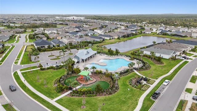 bird's eye view featuring a water view and a residential view