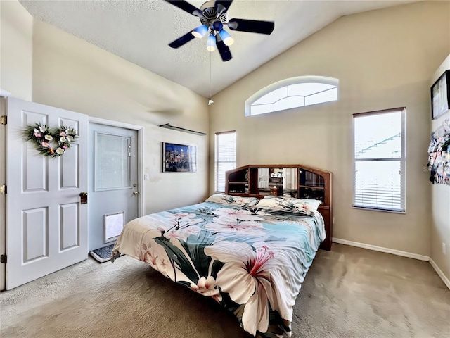 carpeted bedroom featuring vaulted ceiling, baseboards, and ceiling fan