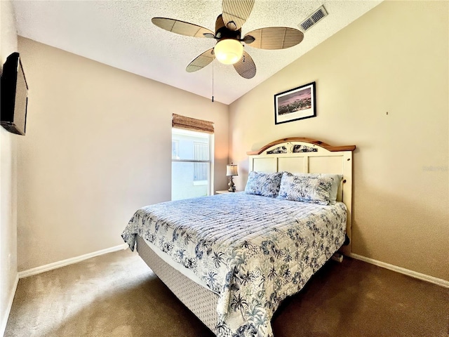 carpeted bedroom with visible vents, vaulted ceiling, a textured ceiling, ceiling fan, and baseboards