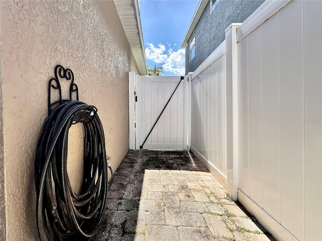 view of patio featuring a gate