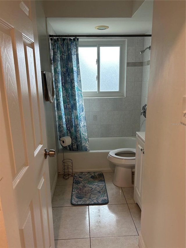 full bath featuring shower / bath combination with curtain, tile patterned flooring, and toilet