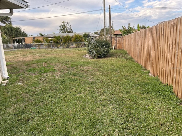 view of yard with a fenced backyard