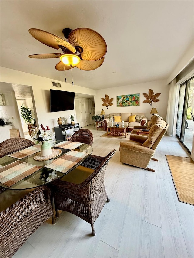 interior space featuring visible vents, light wood-type flooring, and ceiling fan