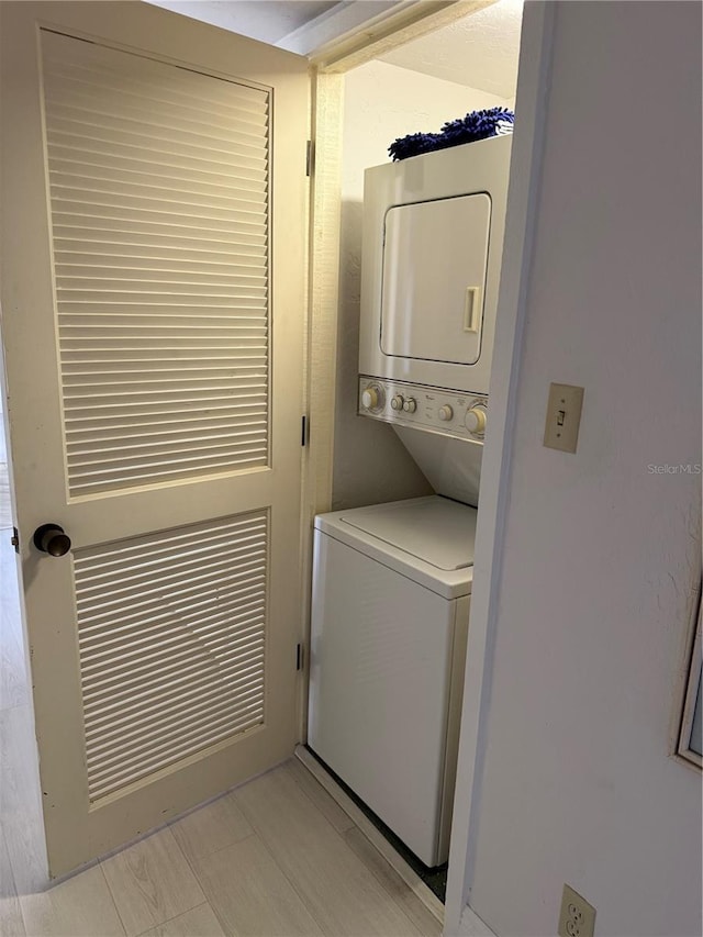 laundry area featuring laundry area and stacked washing maching and dryer