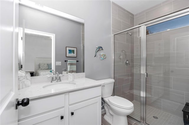 ensuite bathroom with a stall shower, visible vents, connected bathroom, toilet, and vanity