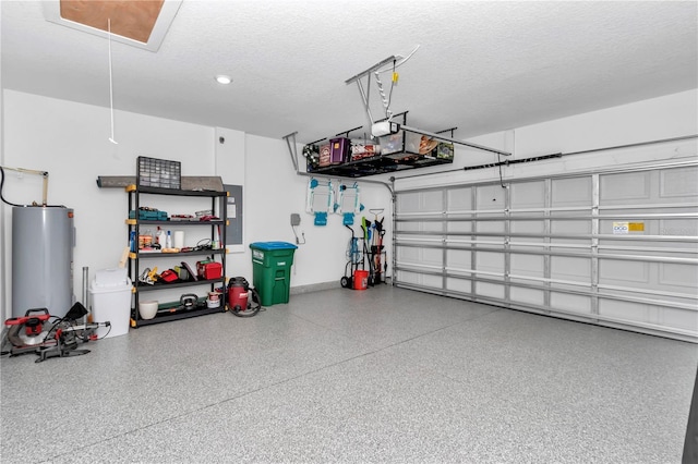 garage featuring water heater and electric panel