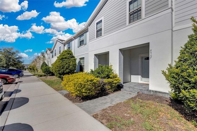 view of property exterior featuring a residential view and stucco siding