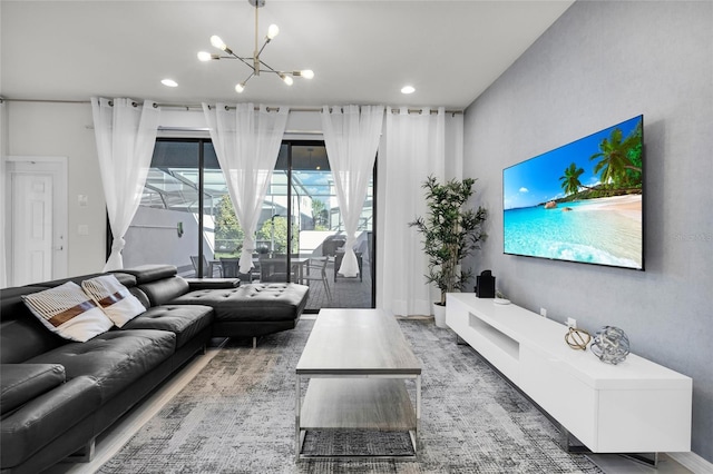 living room with a notable chandelier and recessed lighting