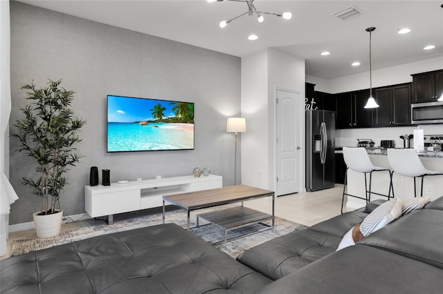 living room featuring light tile patterned flooring, visible vents, and recessed lighting