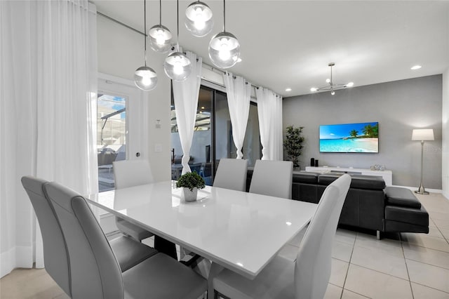 dining area featuring recessed lighting, a notable chandelier, and light tile patterned flooring