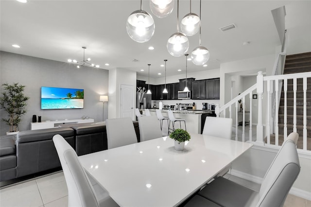 dining area with light tile patterned floors, stairway, visible vents, and recessed lighting