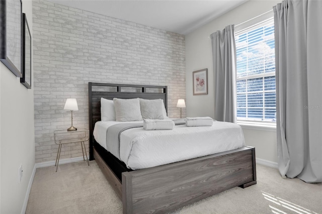 carpeted bedroom with a fireplace and baseboards