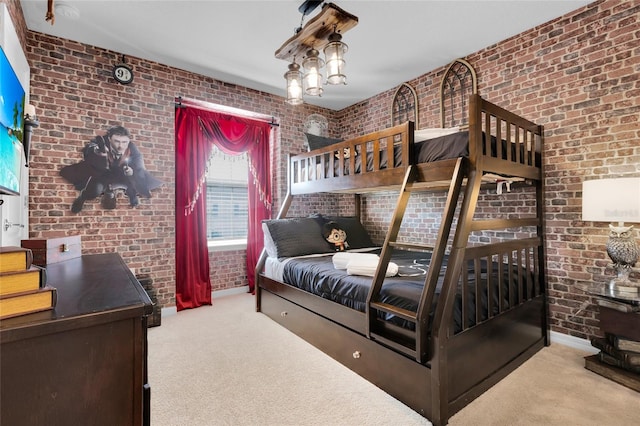 carpeted bedroom with brick wall