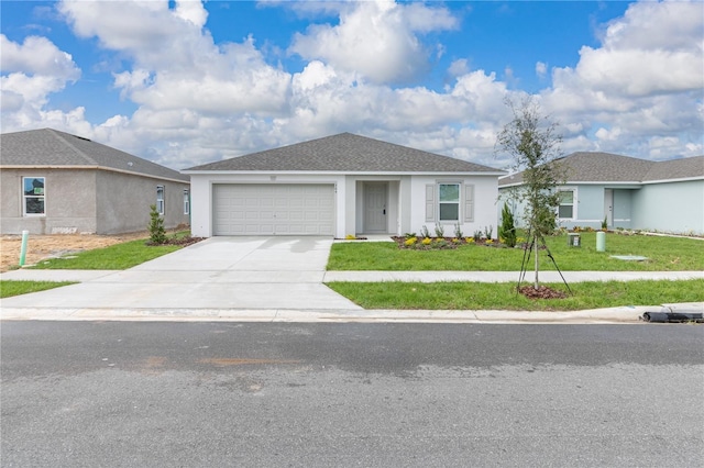 ranch-style house featuring a garage, concrete driveway, roof with shingles, a front lawn, and stucco siding