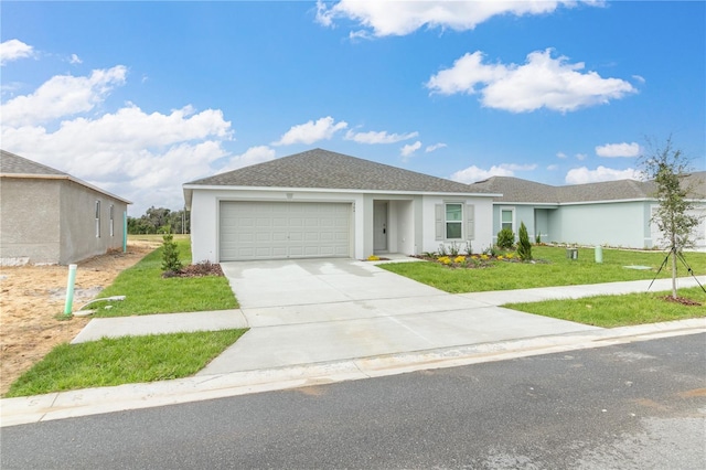 ranch-style home with an attached garage, a shingled roof, driveway, stucco siding, and a front yard