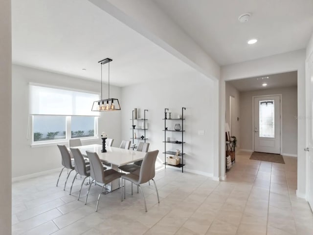 dining area with recessed lighting, light tile patterned flooring, and baseboards