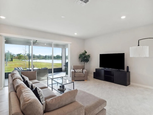 living room with baseboards, visible vents, and recessed lighting