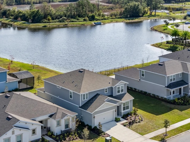 aerial view with a residential view and a water view