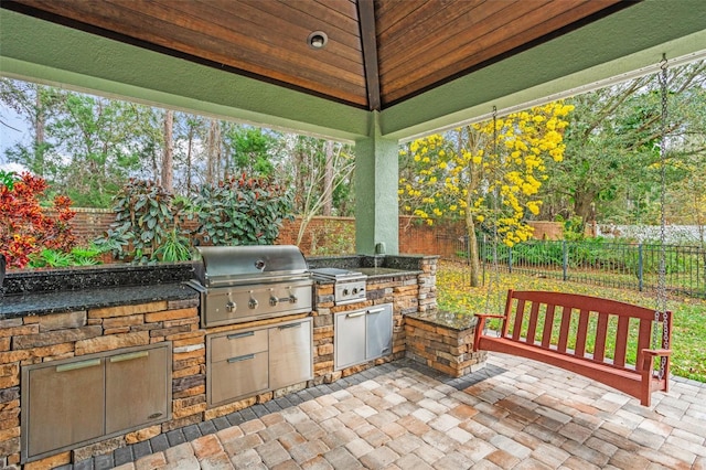 view of patio / terrace with a fenced backyard and area for grilling