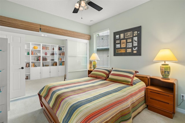 bedroom with ceiling fan and carpet flooring