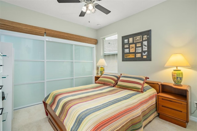 bedroom with ceiling fan and carpet flooring