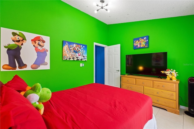 bedroom with light tile patterned floors and a textured ceiling