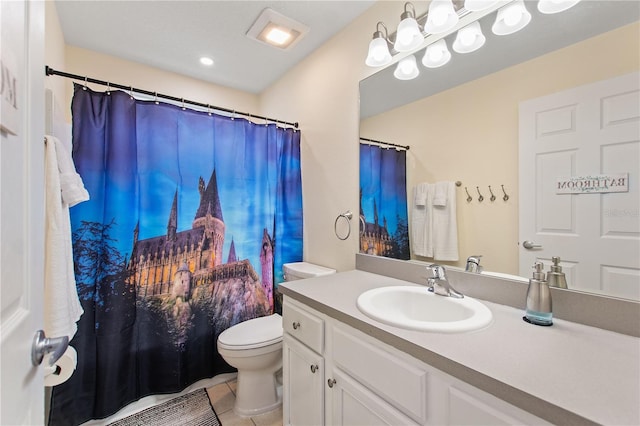 bathroom featuring toilet, curtained shower, tile patterned flooring, and vanity