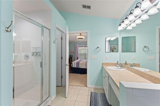 full bathroom featuring ensuite bathroom, tile patterned flooring, a sink, visible vents, and a stall shower