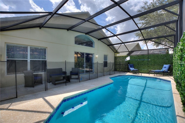 view of swimming pool featuring a lanai, a patio area, and a fenced in pool