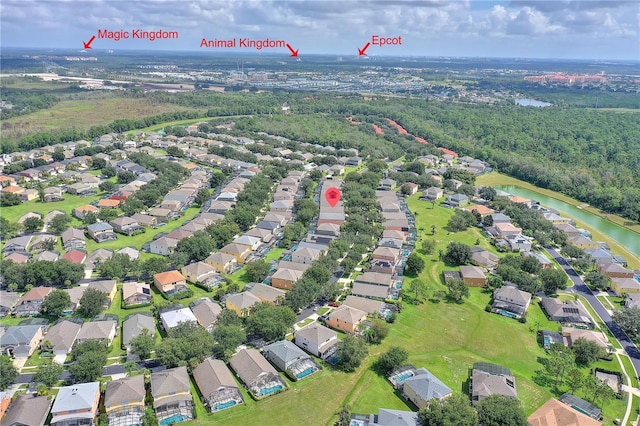 drone / aerial view featuring a water view and a residential view